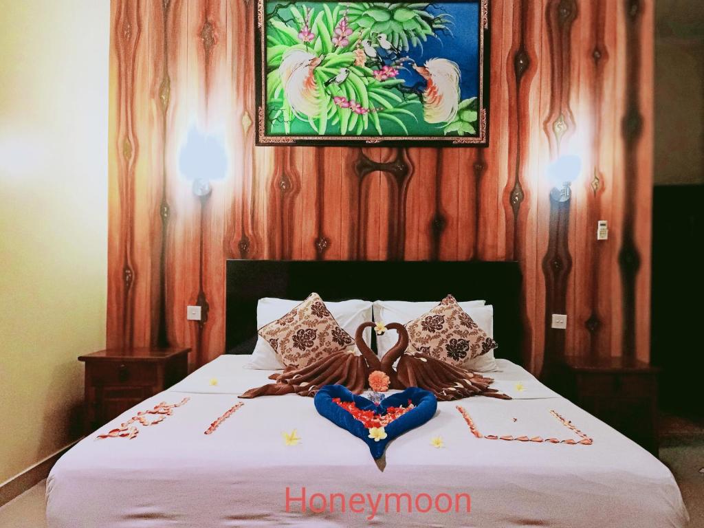 Bedroom with bathroom at Bali Bhuana Villas