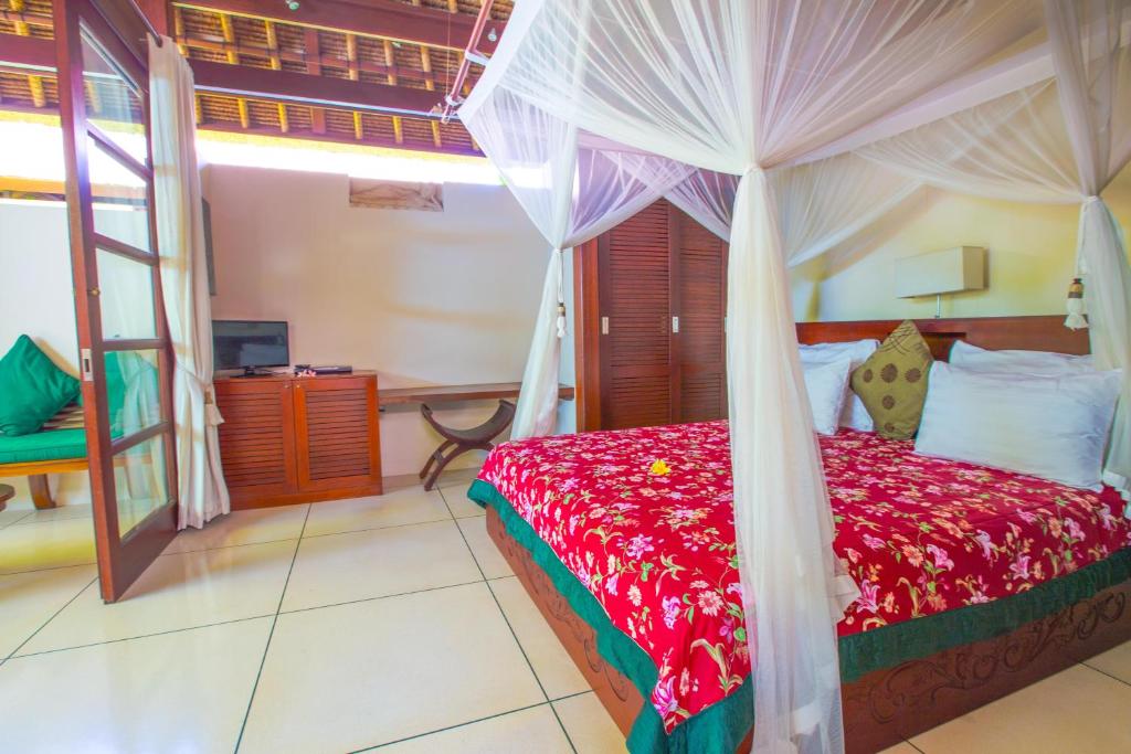 Bedroom with TV at Bali Harmony Villa