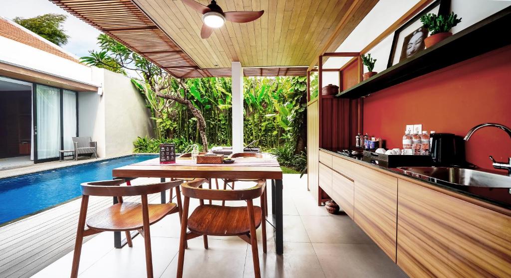 Kitchen with table at Beautiful Bali Villas