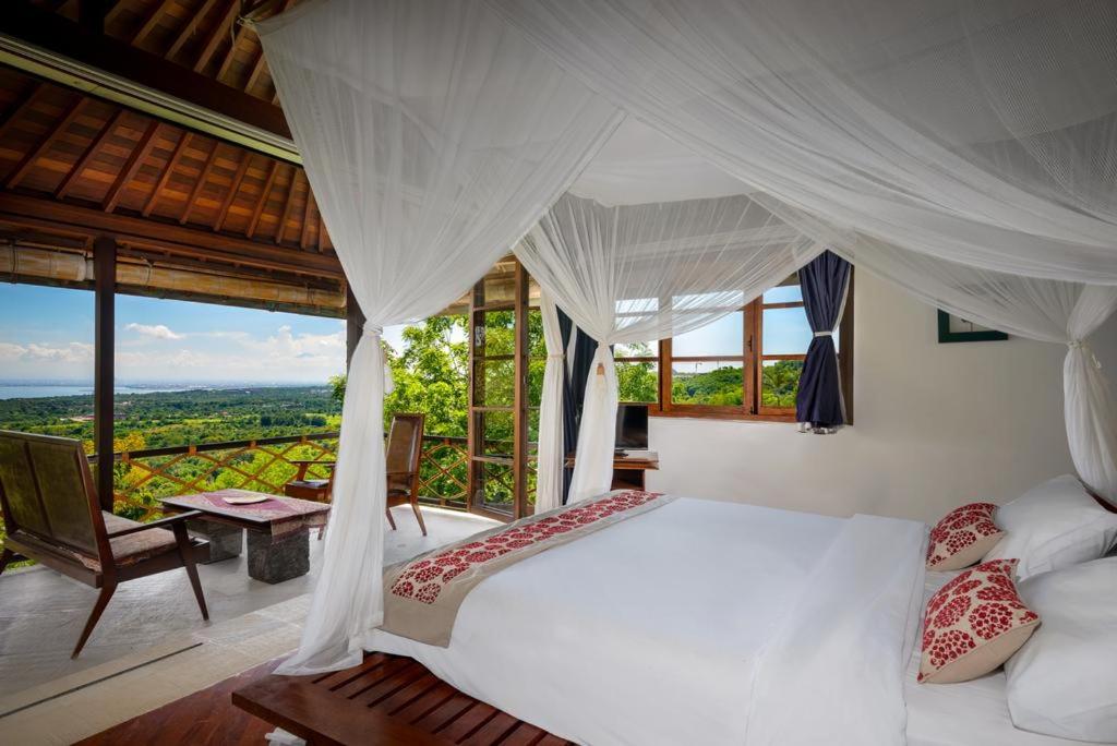 Bedroom with view at Canang Sari Uluwatu Villas Bali