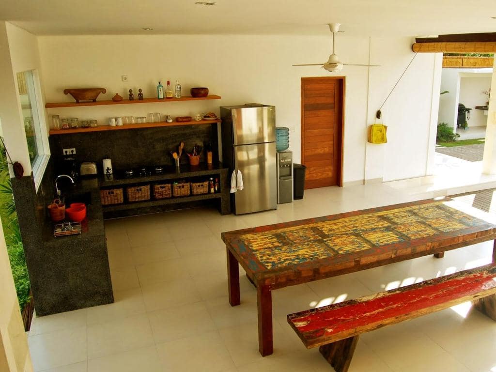 Kitchen with table at Casa Margarita Bali