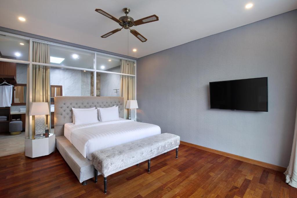 Bedroom with TV at The Daha Luxury Villas