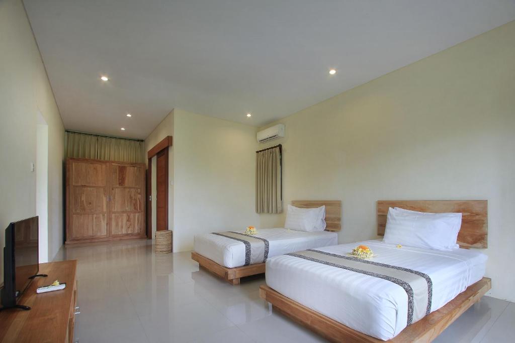 Twin bed at Kabinawa Ubud Villas 