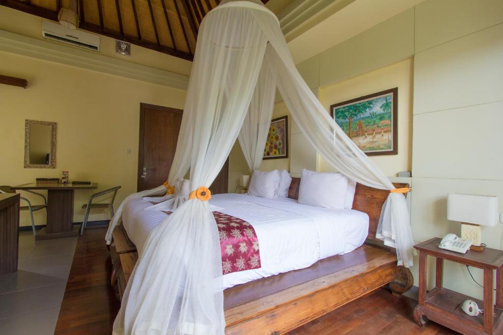 Bedroom with AC at Ladera Villa Ubud