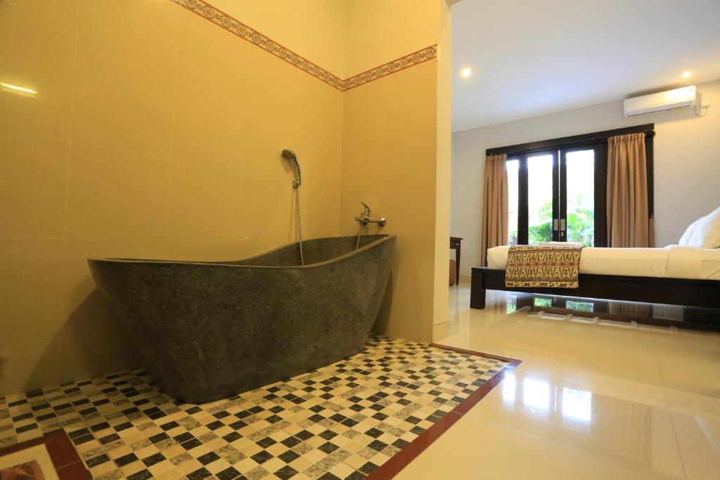 Bedroom with private pool at Nyoman Villa Sanur