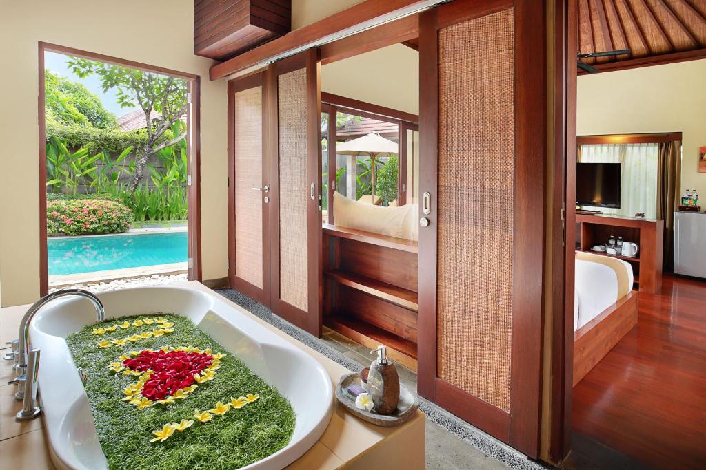 Private pool with rose at Nyuh Bali Villas