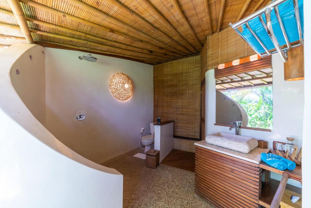 Shower with wash room at Villa Istana Putih by Nakula