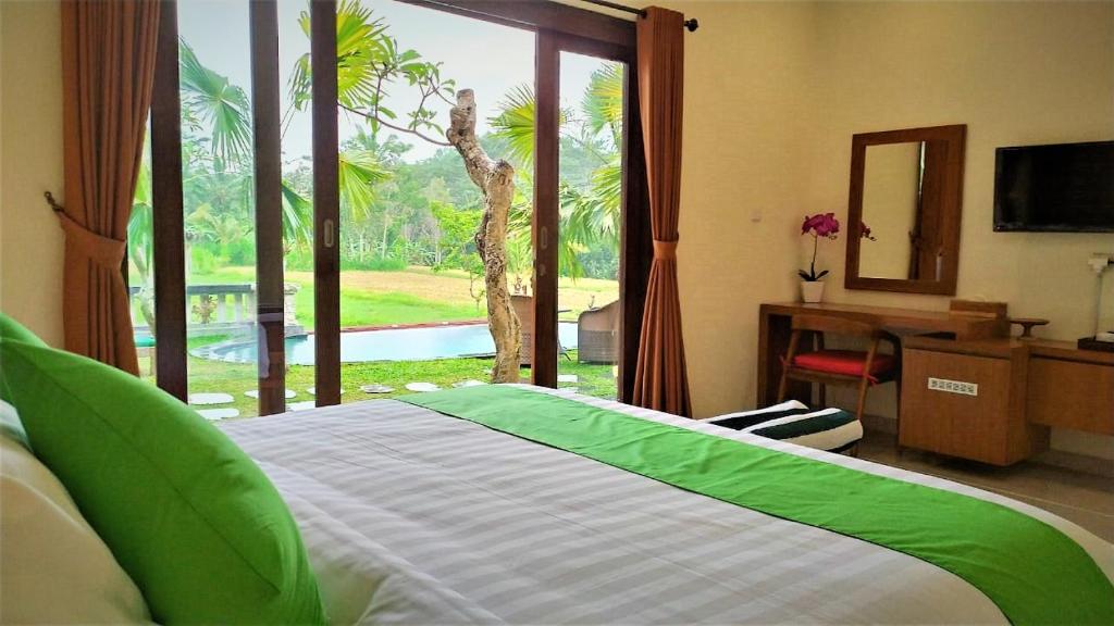 Bedroom with garden view at Vamana Villa