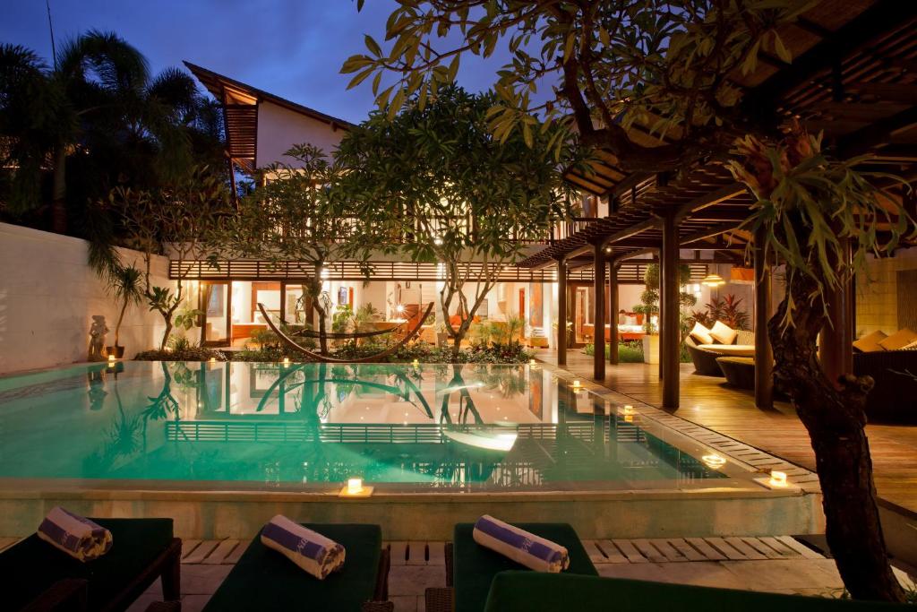Swimming pool with towel at Nagisa Bali