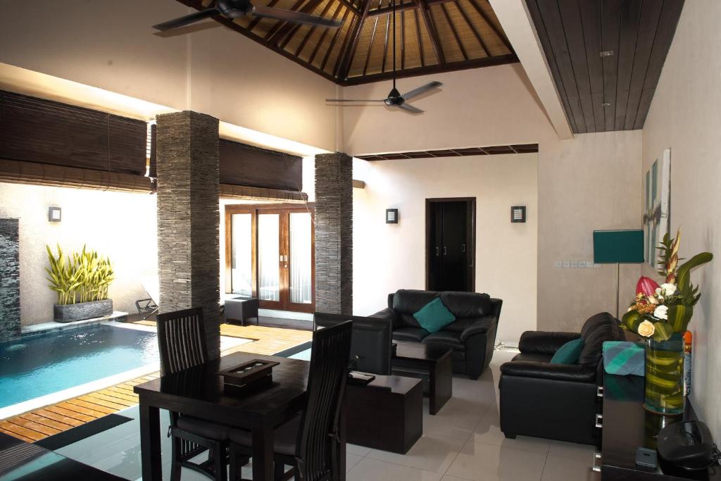 Living hall with swimming pool at My Villas In Bali
