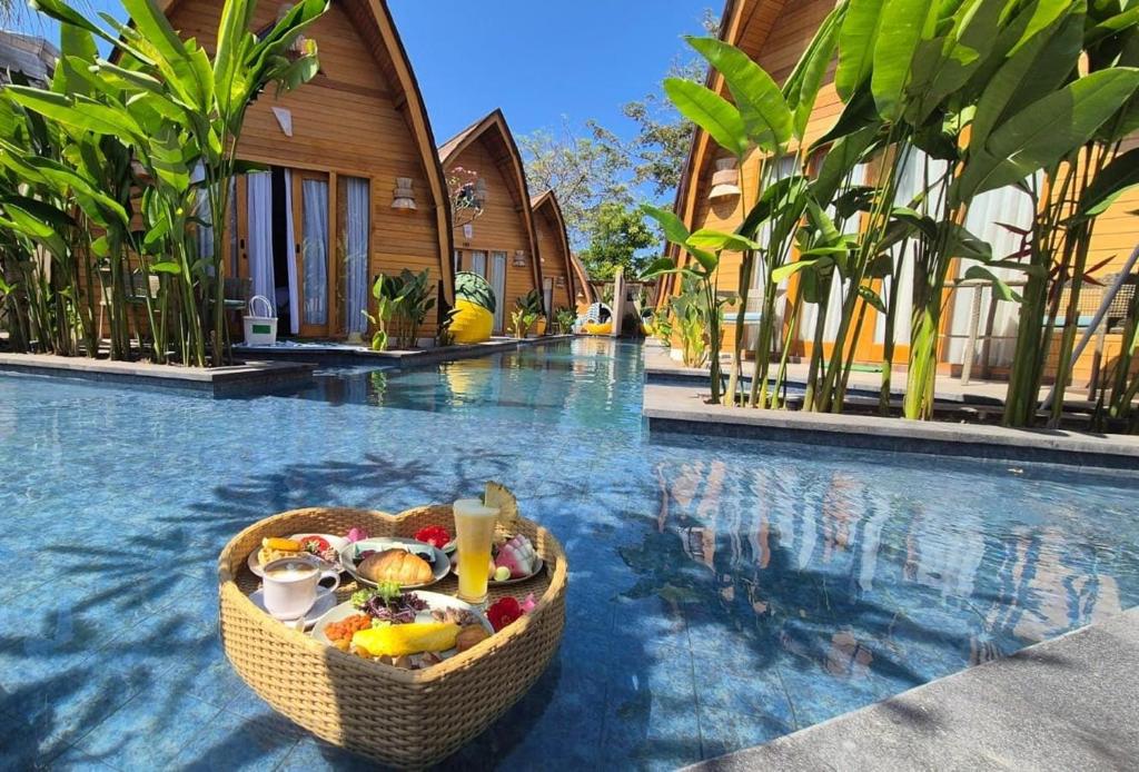 Floating breakfast in a pool at a tropical villa