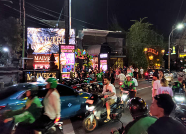 Seminyak nightlife street with neon lights