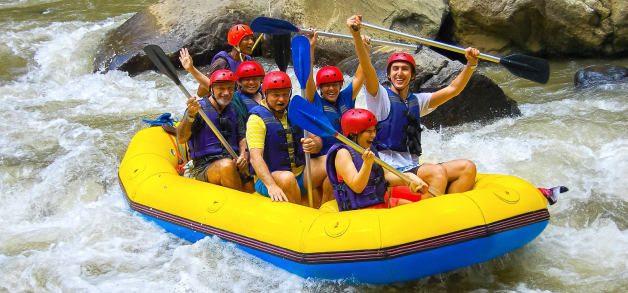 Group white-water rafting on a river