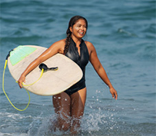 Woman surfing in Bali