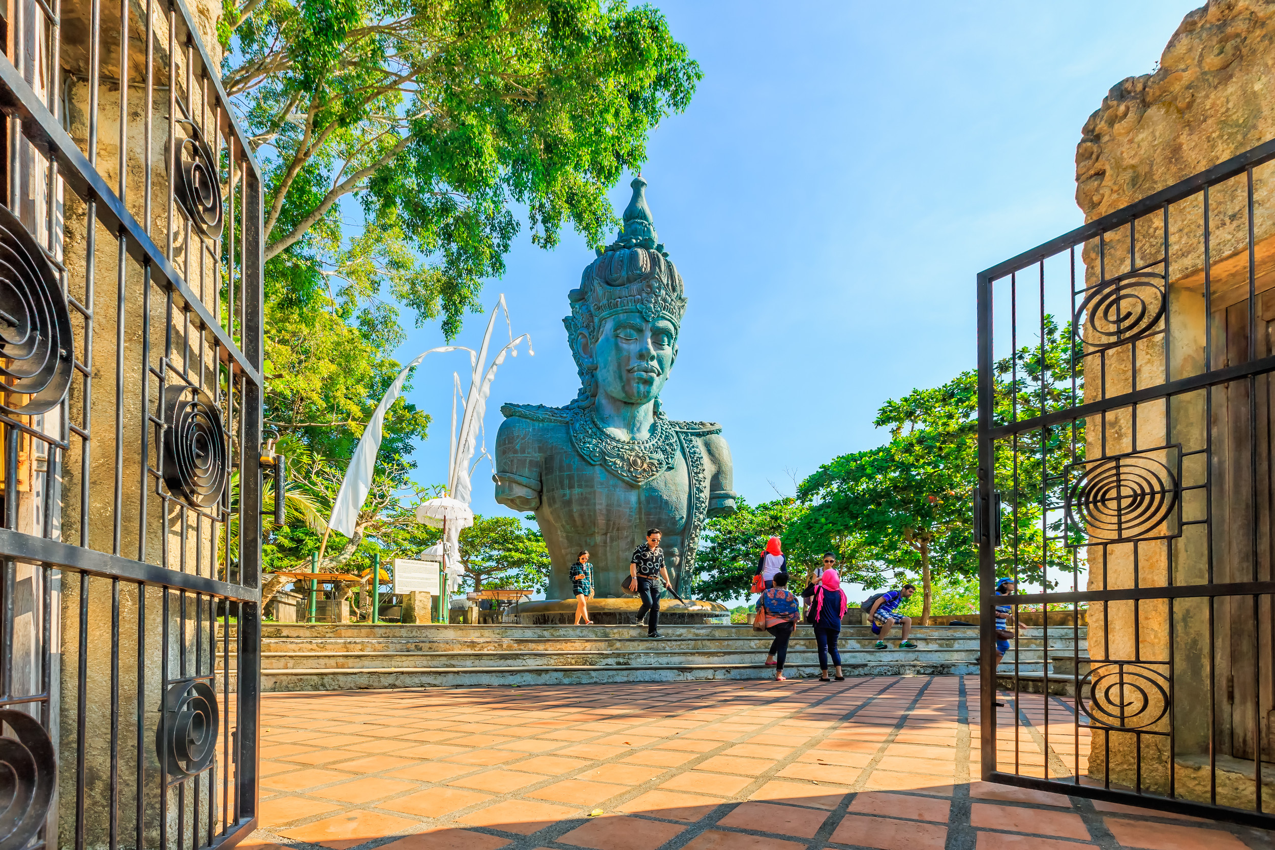 Giant statue of Vishnu framed by an open gate