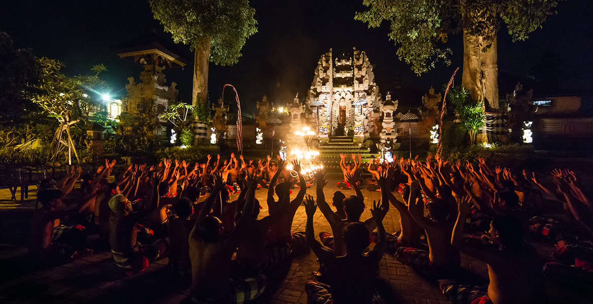 Evening ritual with fire and temple backdrop