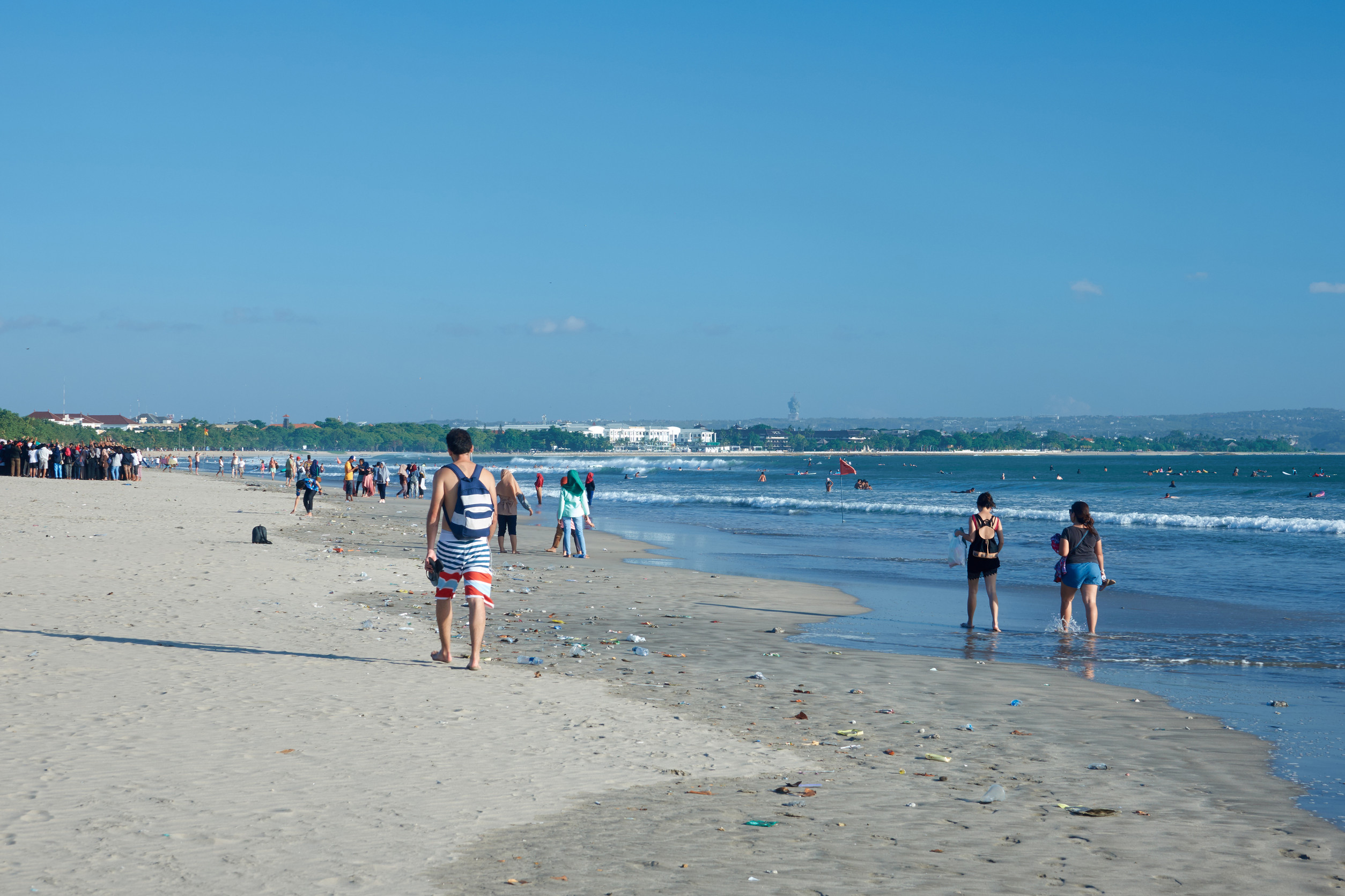 People strolling along the beach