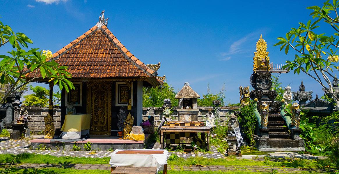 Colorful shrine with intricate carvings and offerings