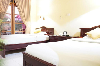 Hotel room with white and red decor