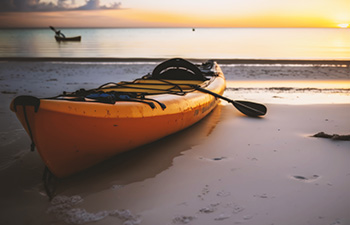 Orange kayak on Sanur shore