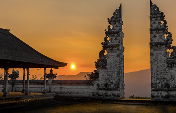 Gate of Heaven temple with orange sunset sky