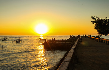 Sunrise with boats and gazebo