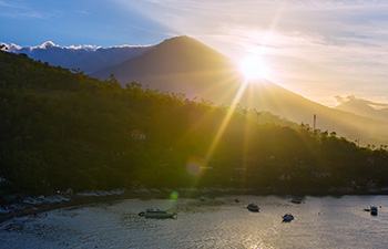Early morning sun shining over Amed coastline and hills