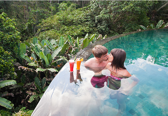 Couple in infinity pool at Seminyak villa
