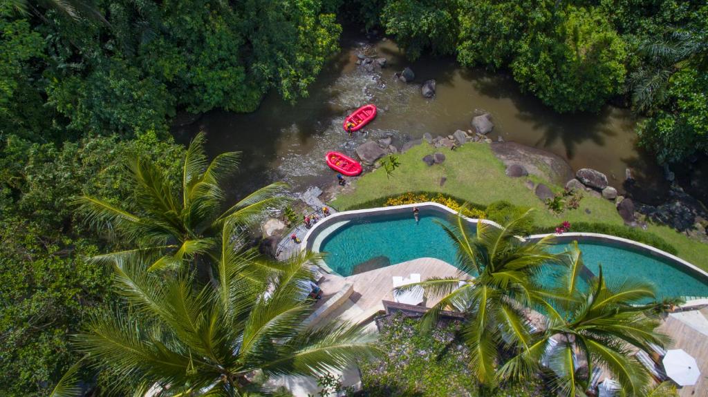 Riverside pool villa with kayaks