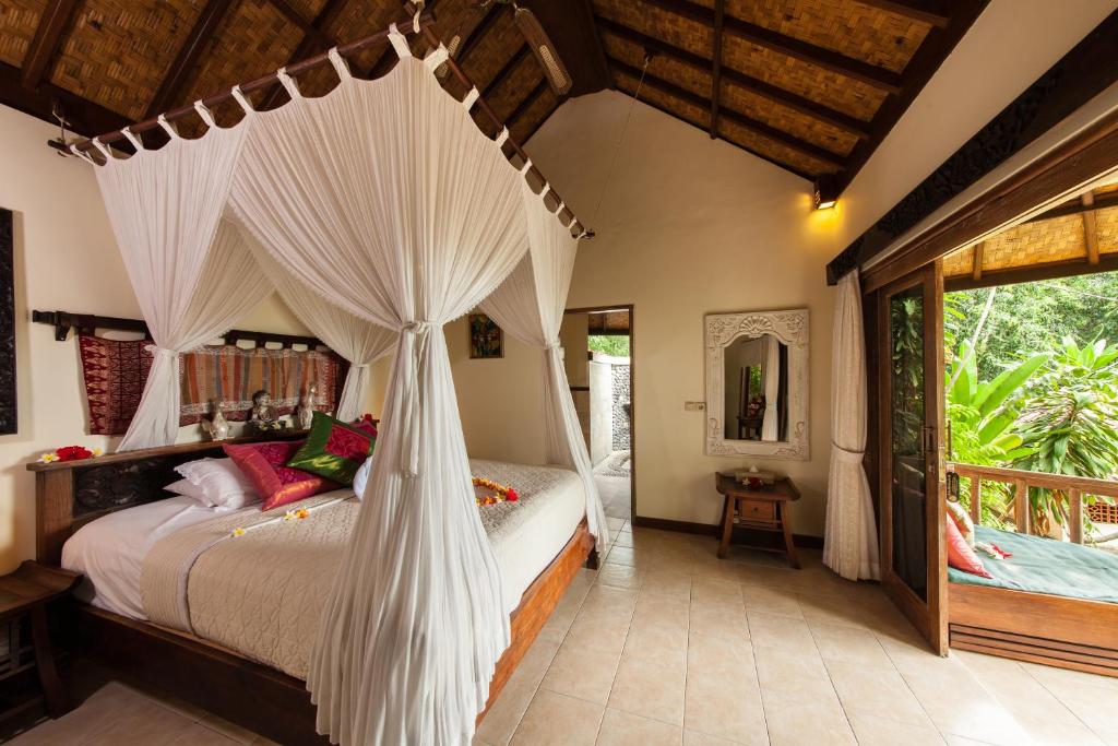 Rustic villa bedroom with canopy bed