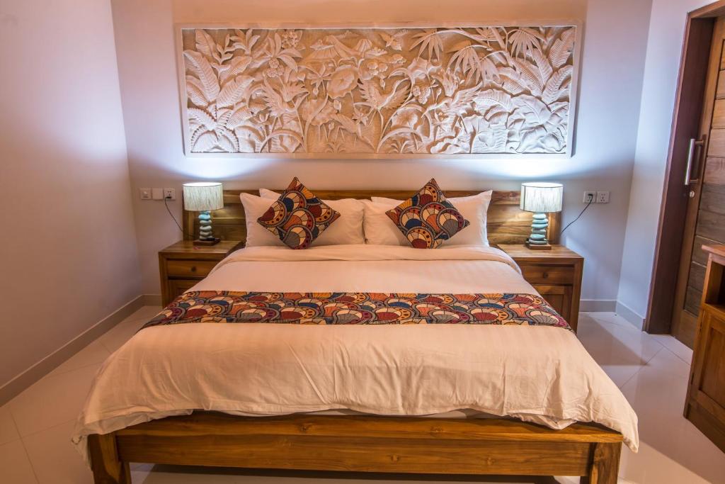 Cozy bedroom with wooden carvings and warm decor