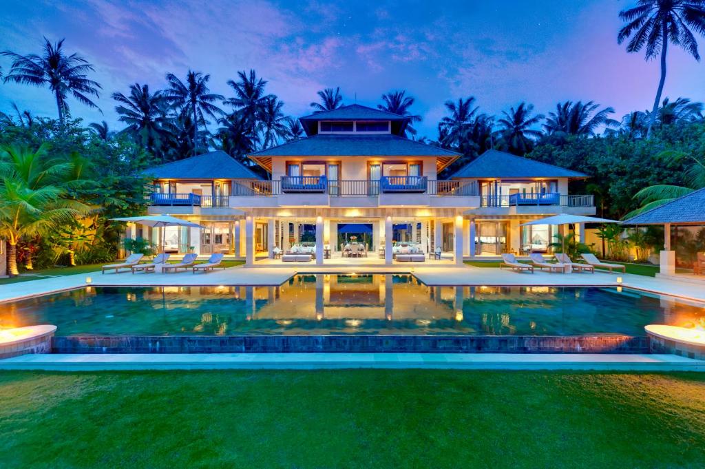 Luxury villa with a large pool and tropical landscaping