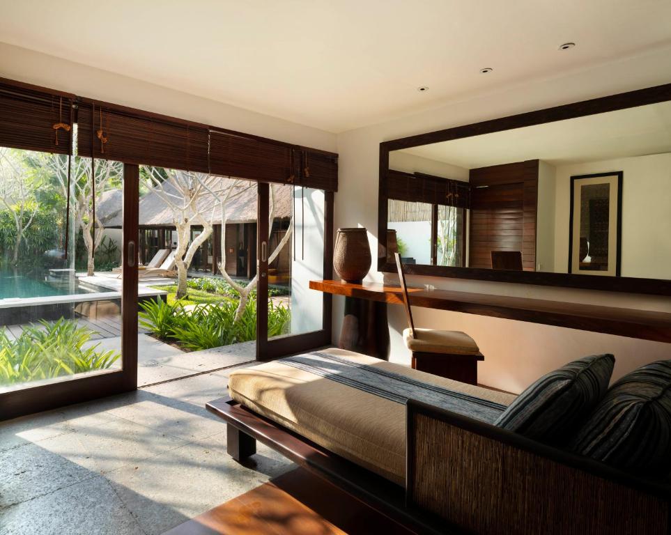 Stylish bedroom with a garden and pool view