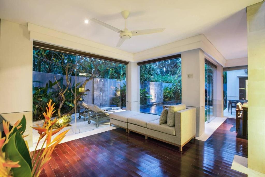 Modern living room with garden and pool view