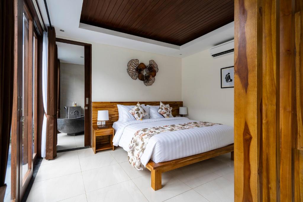 Bedroom with wooden decor and private bath