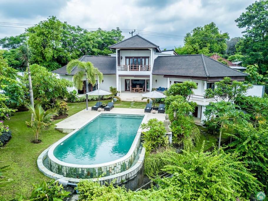 Two-story villa with large garden and pool