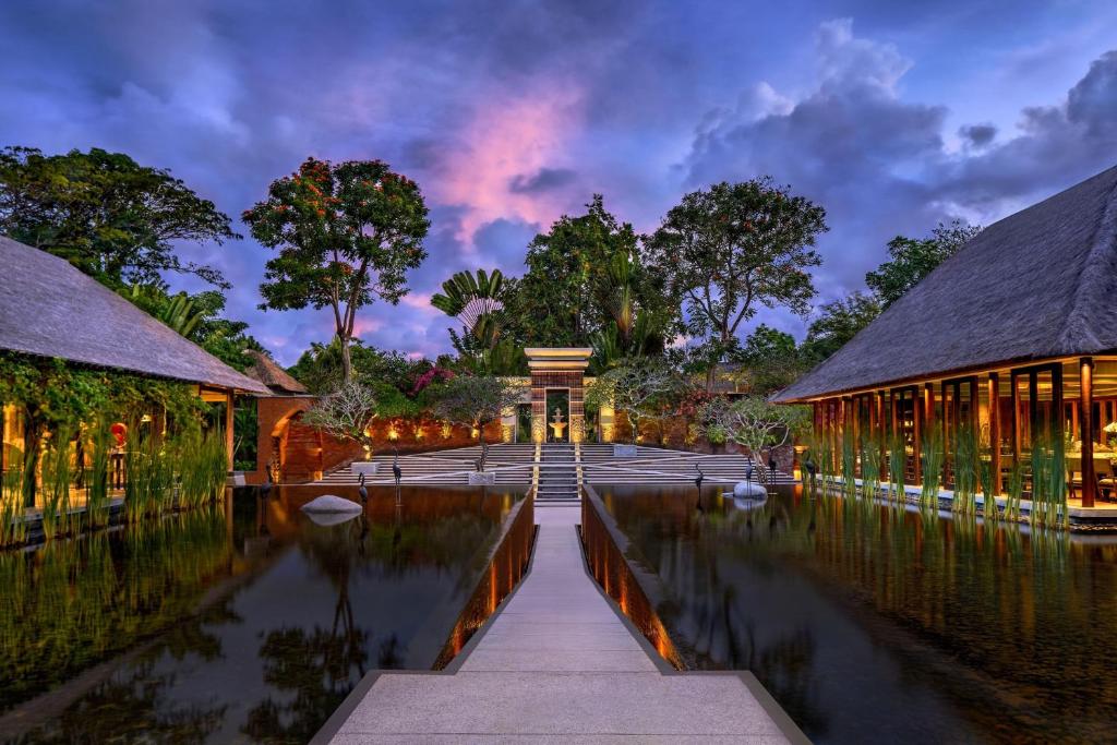 Villa with water feature and lush garden