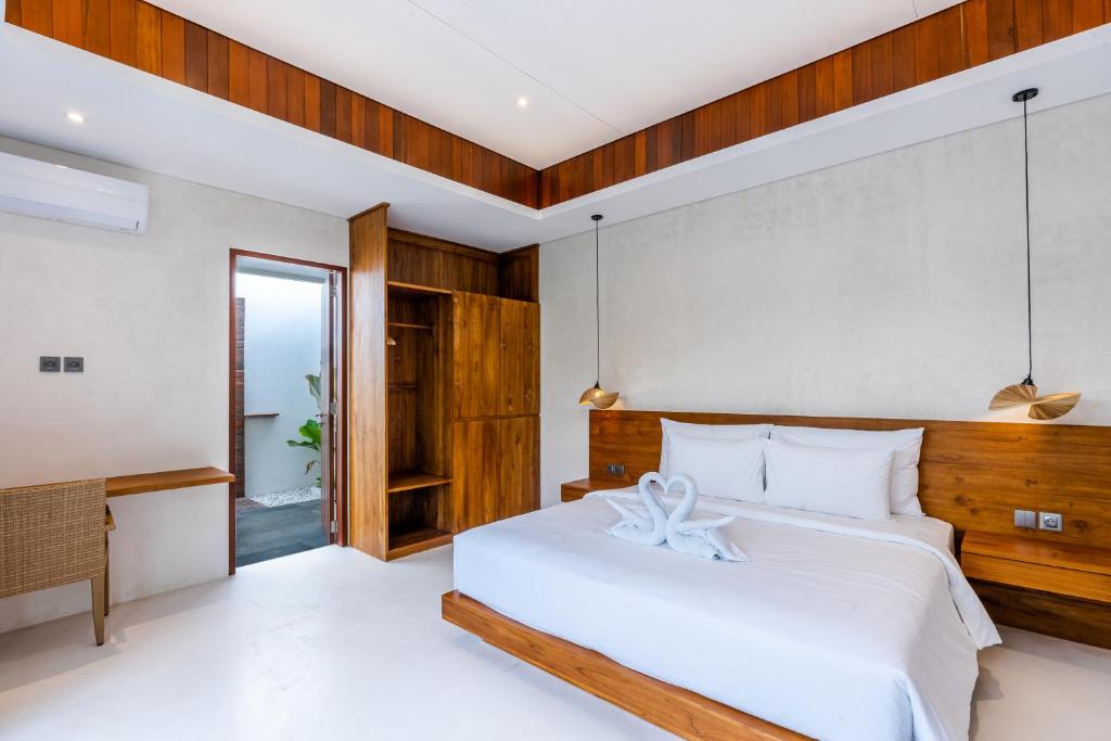 Minimalist bedroom with a heart-shaped towel decoration