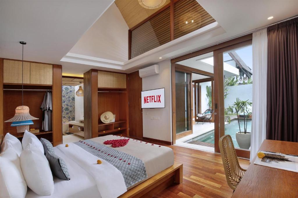 Stylish bedroom with Netflix, and a pool view