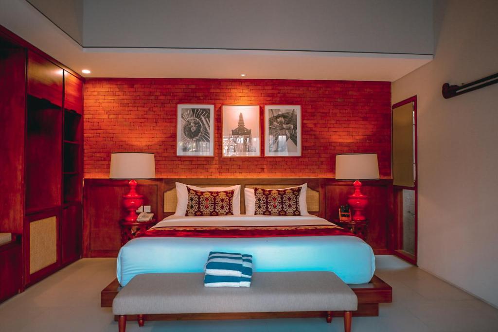 Warmly lit bedroom with red accents and rustic charm