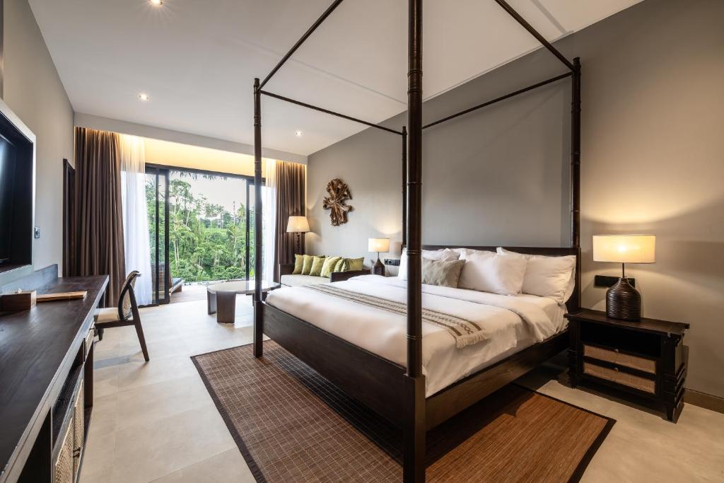 Bedroom with four-poster bed and modern style.